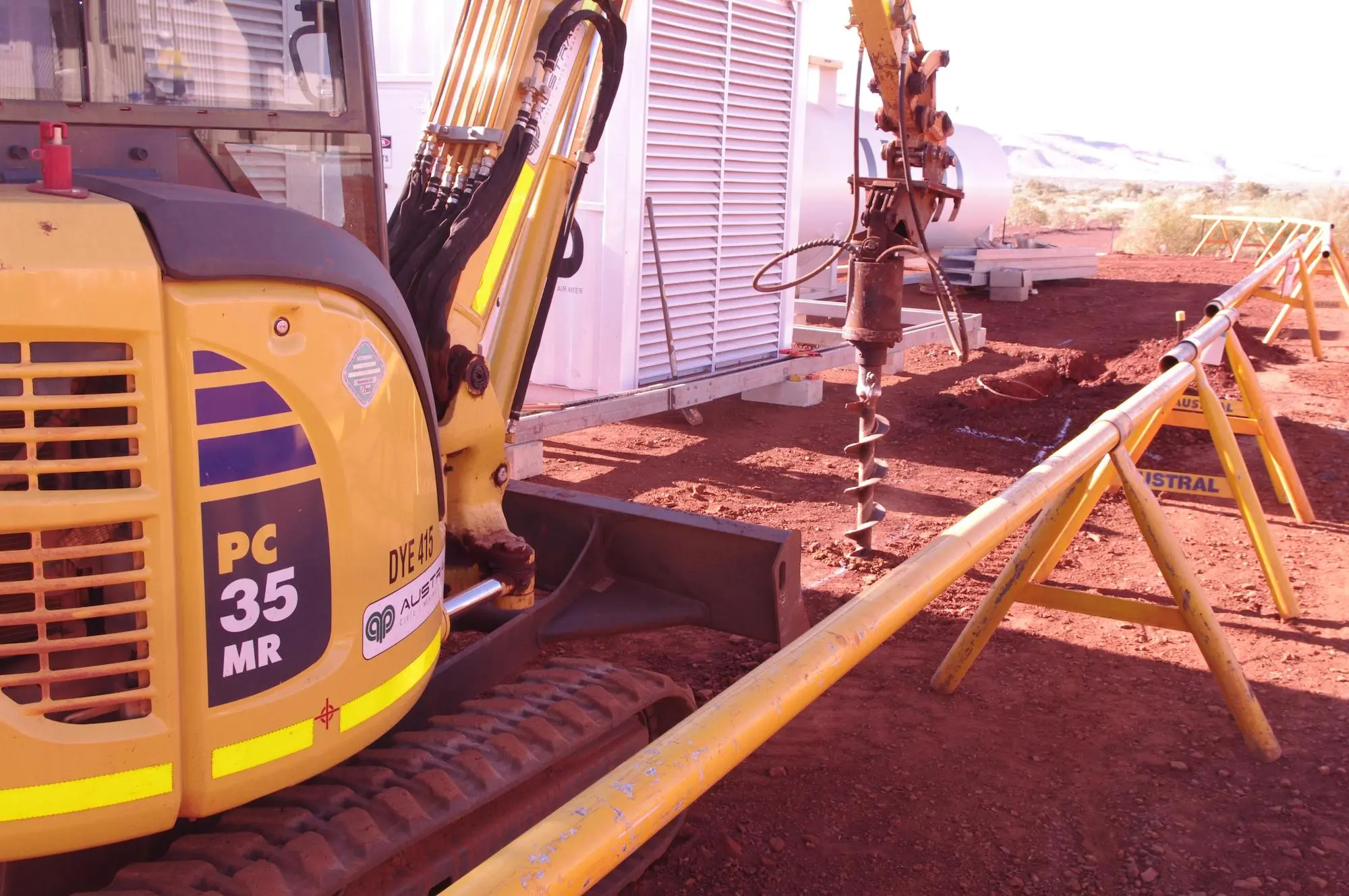 Close-up view of drilling the land