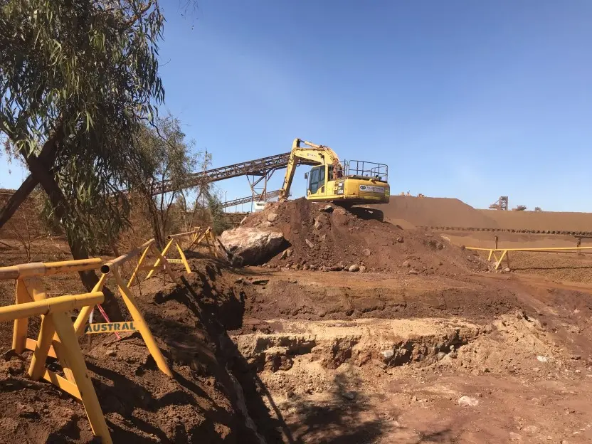 Excavator digging the land