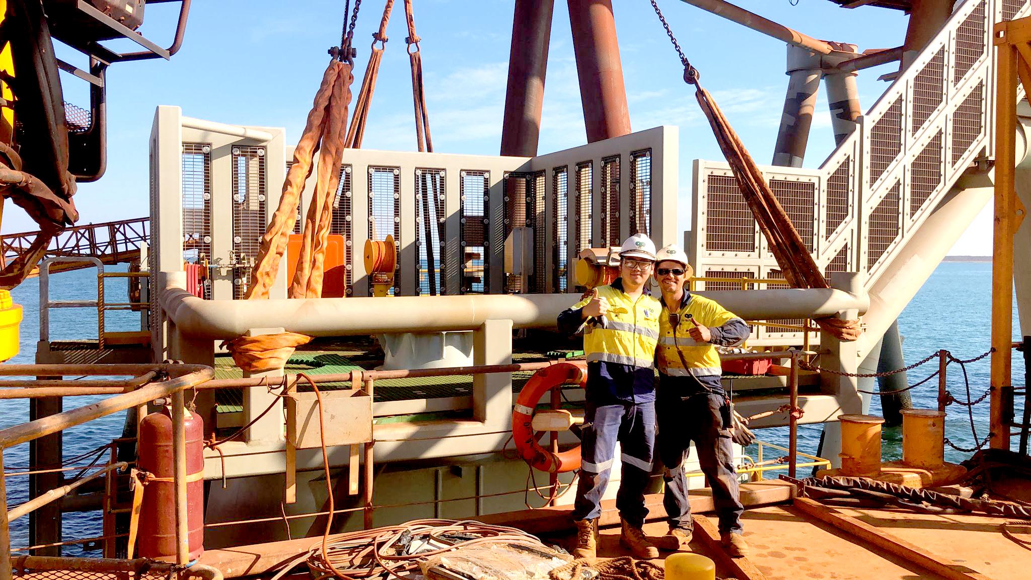 2 male contractors showing thumbs up to the camera
