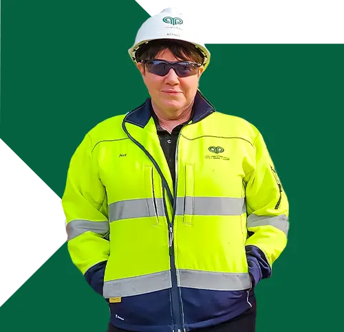 A lady contractor with helment and sunglasses wearing yellow green jacket