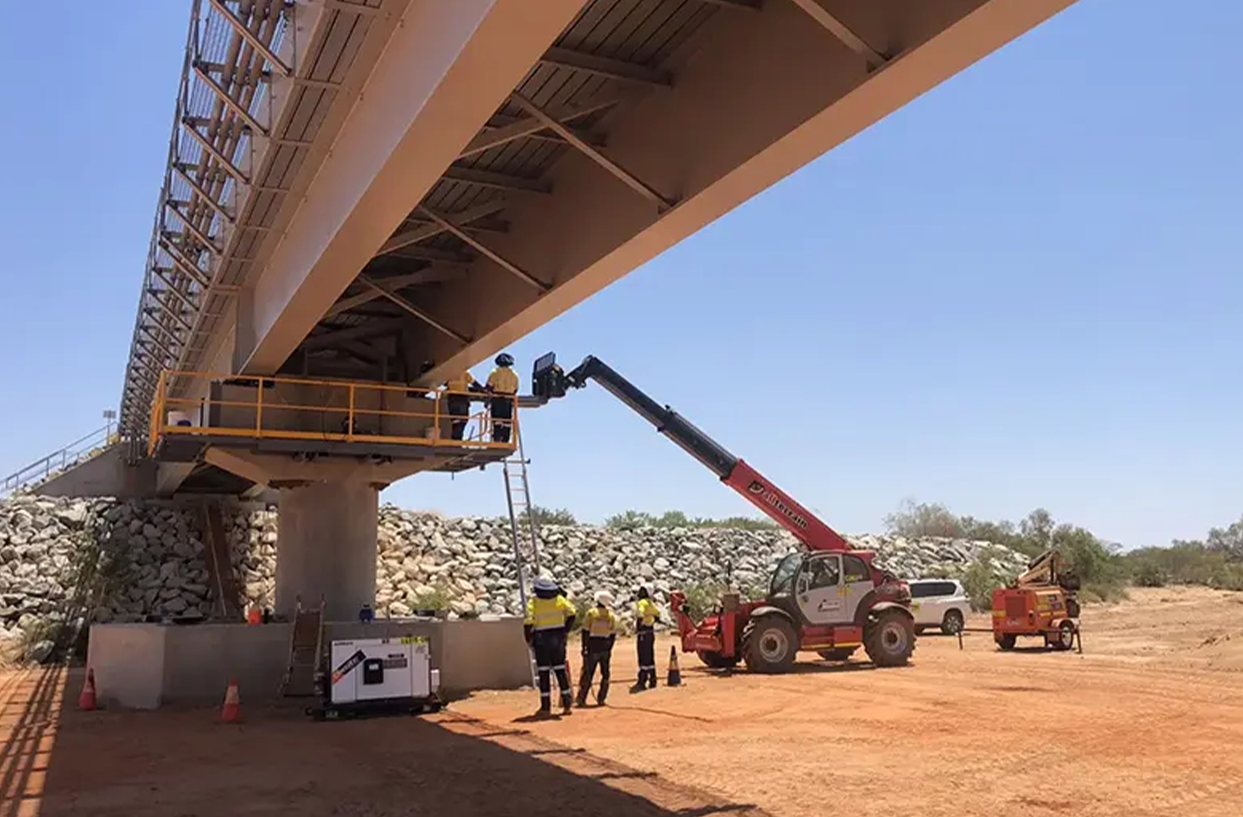 Contractors building a bridge