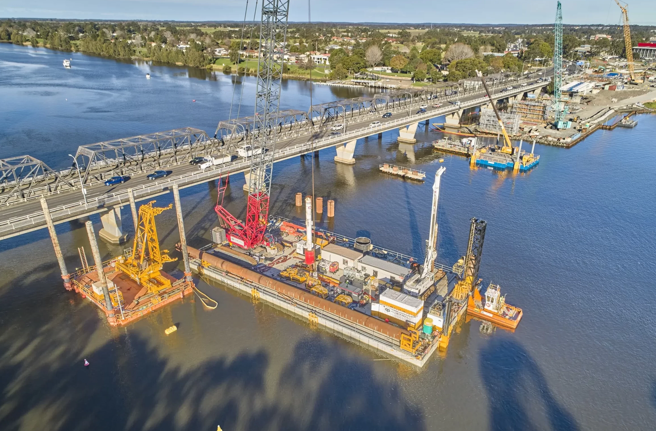 Construction site with big cranes conducting a bridge project